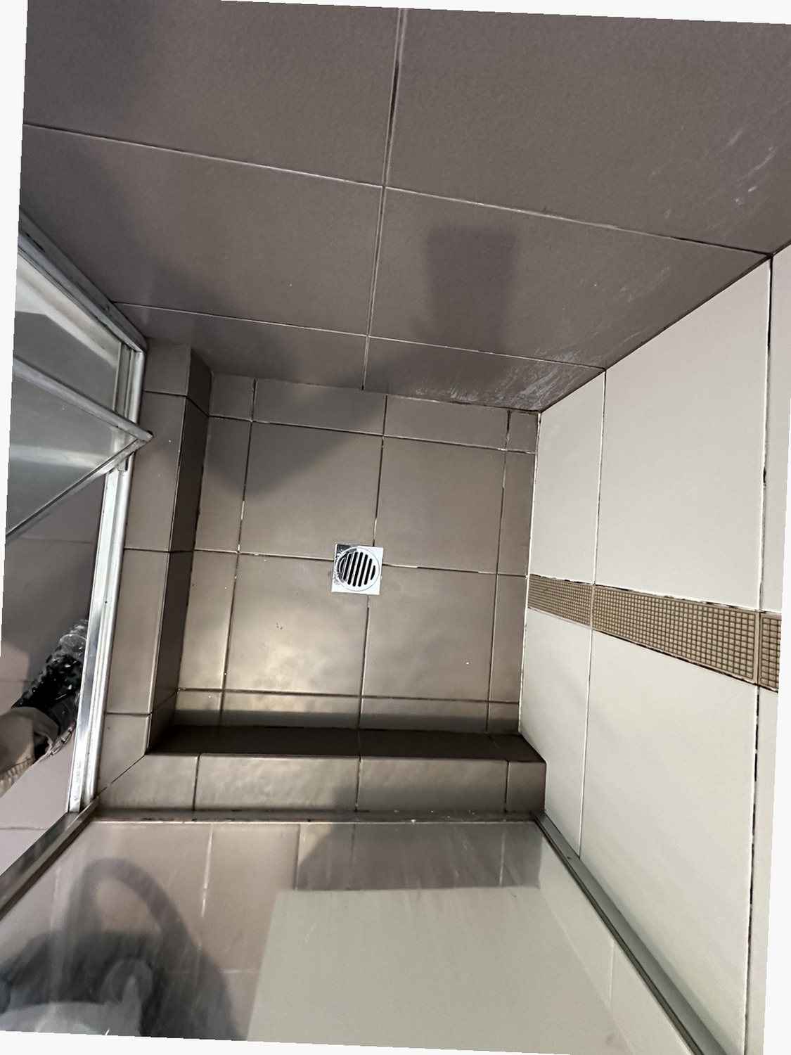 Before view of feature-strip shower