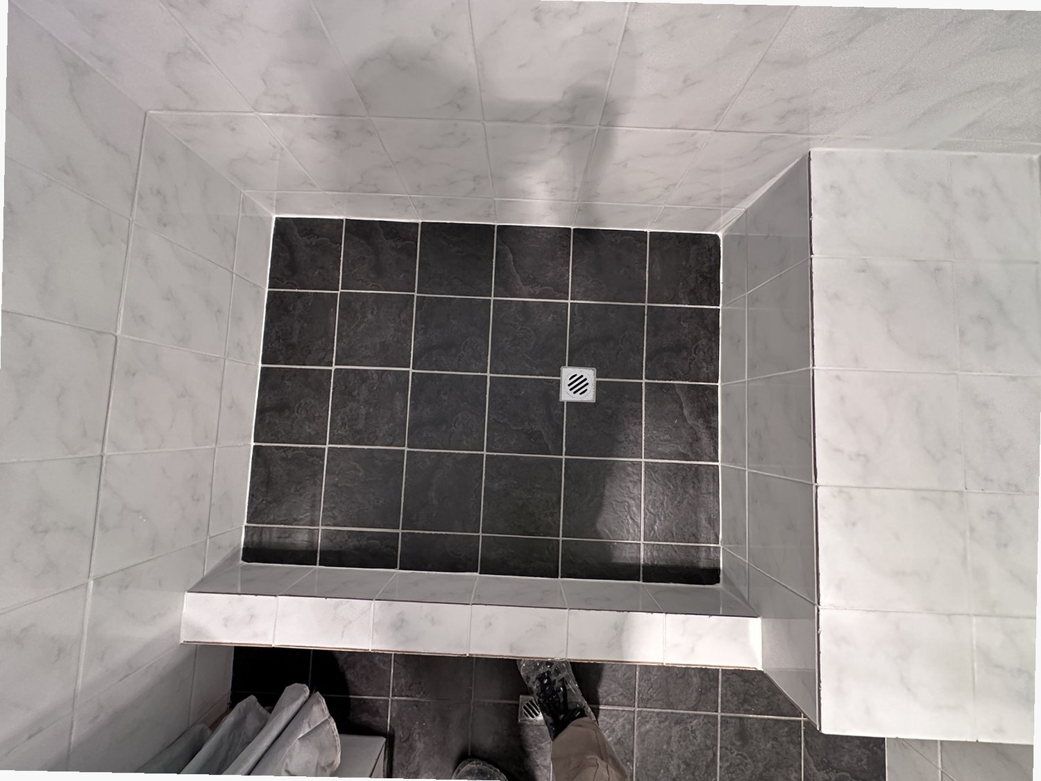 After view of marble contrast shower