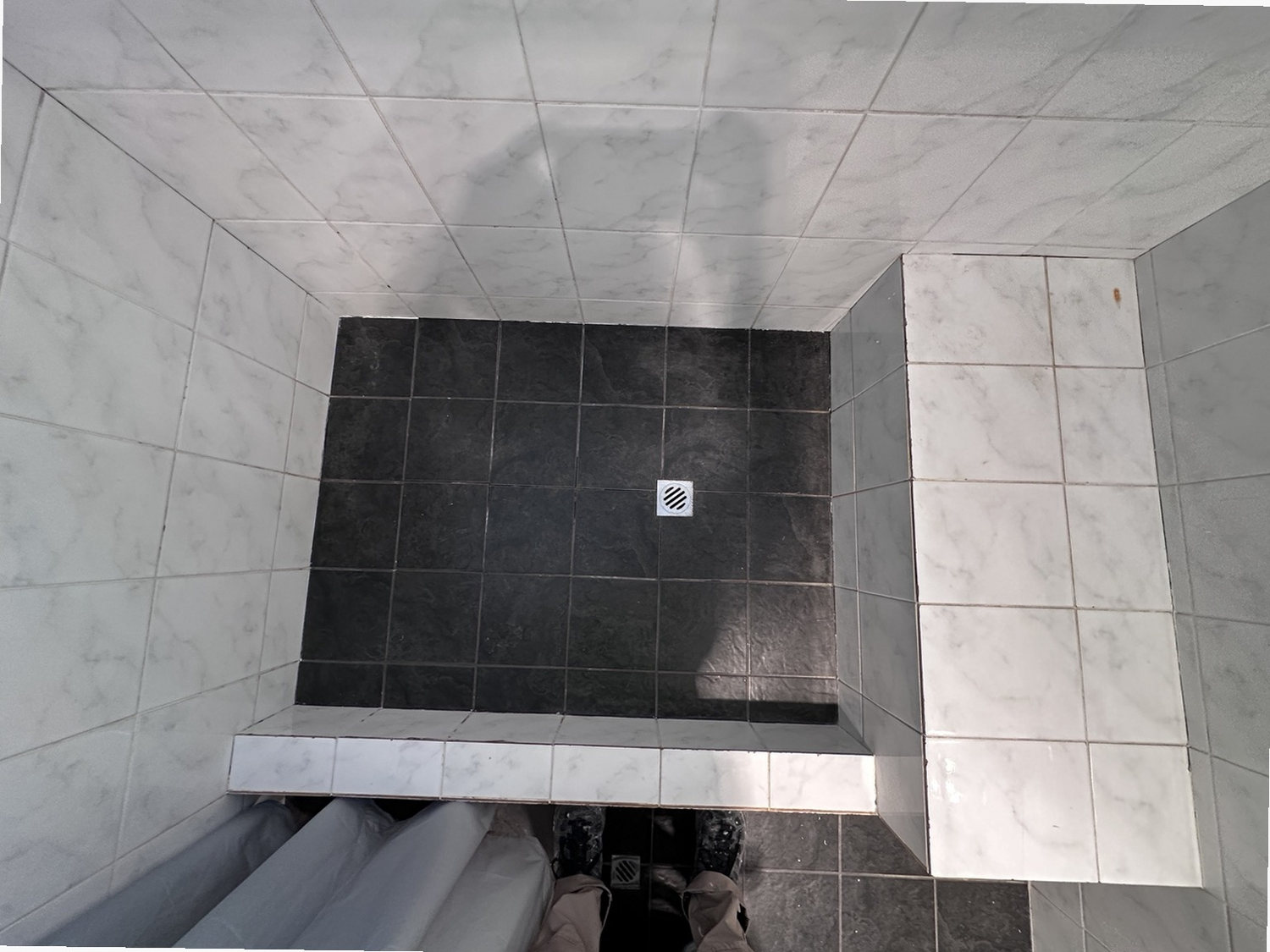 Before view of marble contrast shower