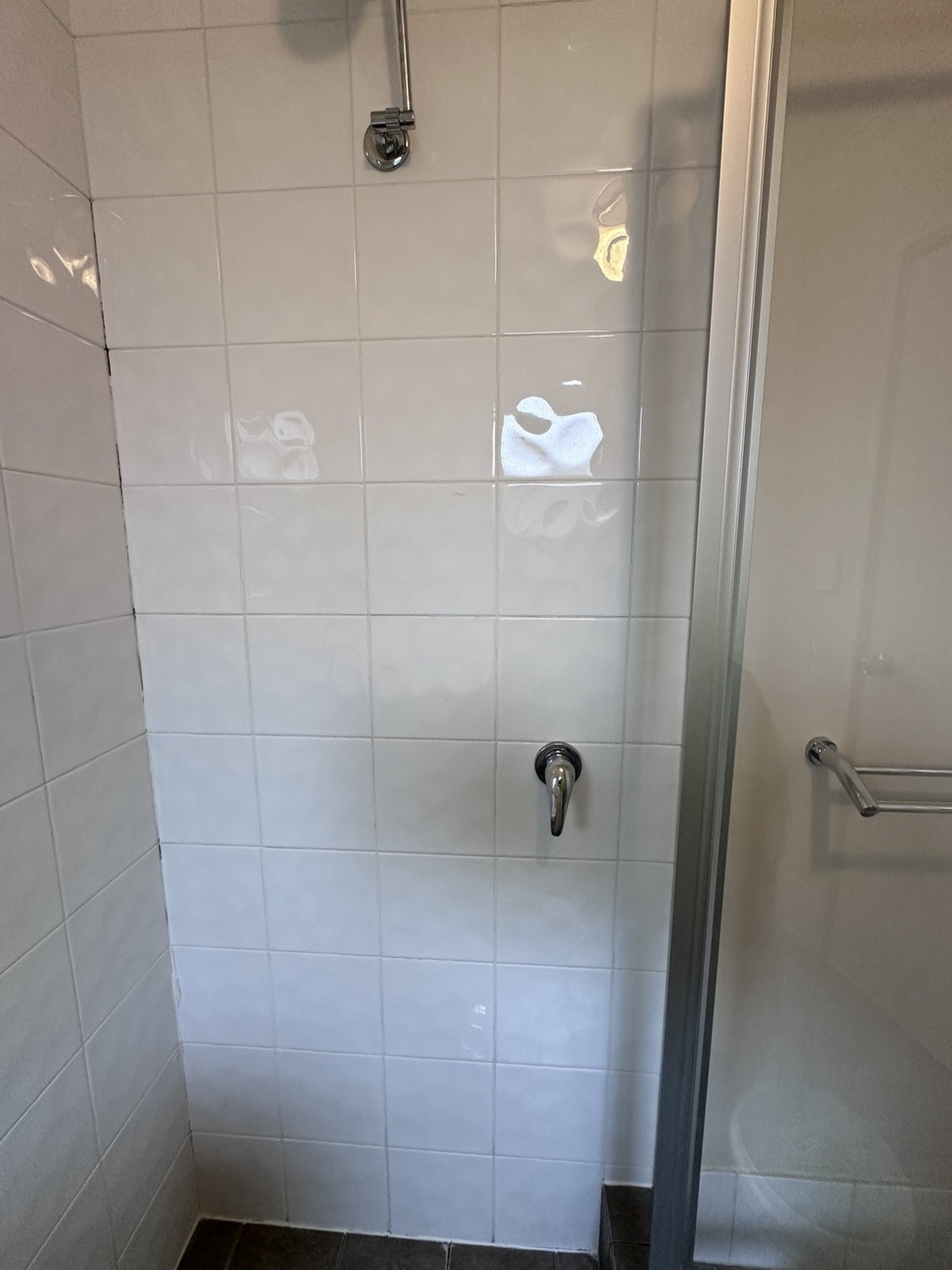 Before view of classic white shower